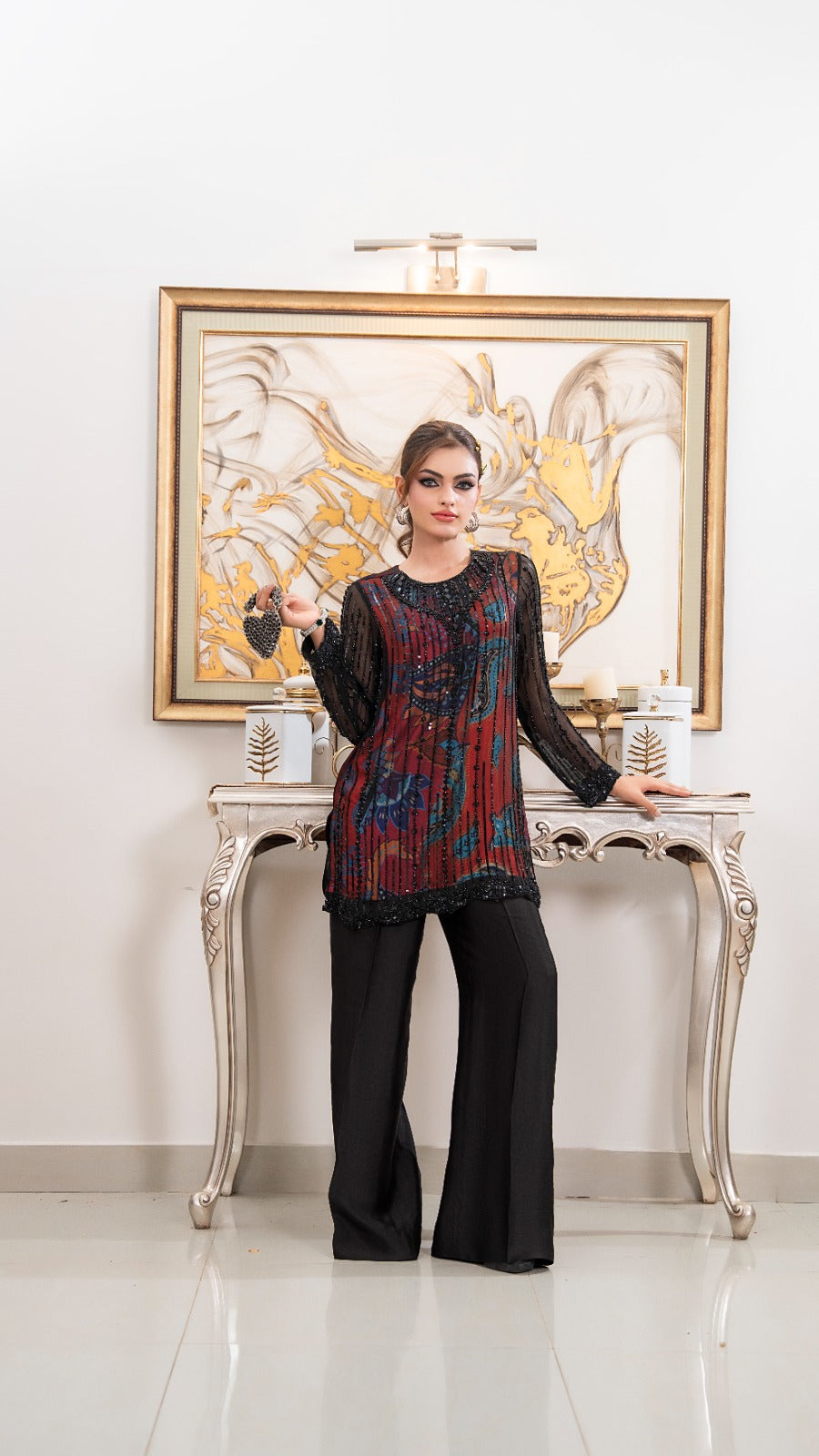 Shop Eclipse by FAMA by Sana Sarah's, a stunning 2-piece black printed chiffon tunic encrusted with jet-black sequin lines, paired with wide-leg silk trousers.