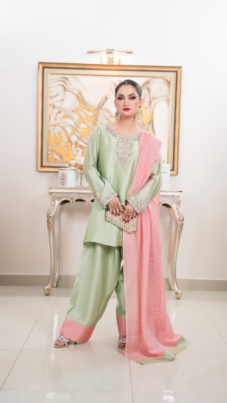 Shop Mint Blush by FAMA by Sana Sarah's, a refreshing 3-piece mint green silk suit featuring hand-worked neckline embroidery, blush pink hemmed trousers, and a contrast pink dupatta.