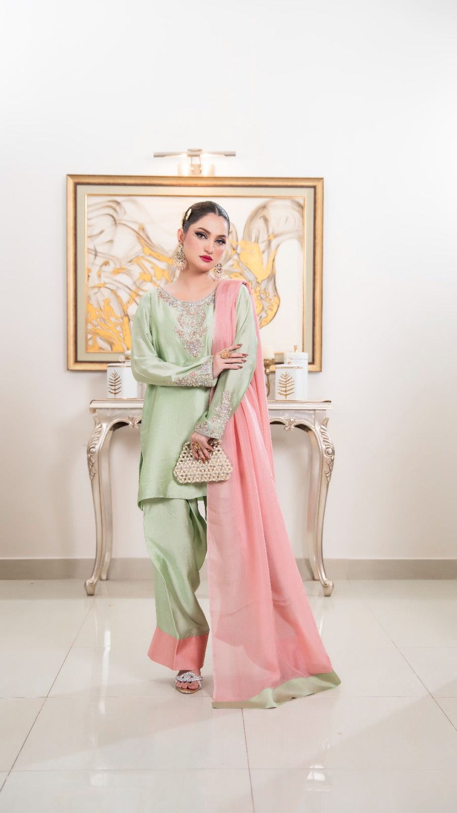 Shop Mint Blush by FAMA by Sana Sarah's, a refreshing 3-piece mint green silk suit featuring hand-worked neckline embroidery, blush pink hemmed trousers, and a contrast pink dupatta.
