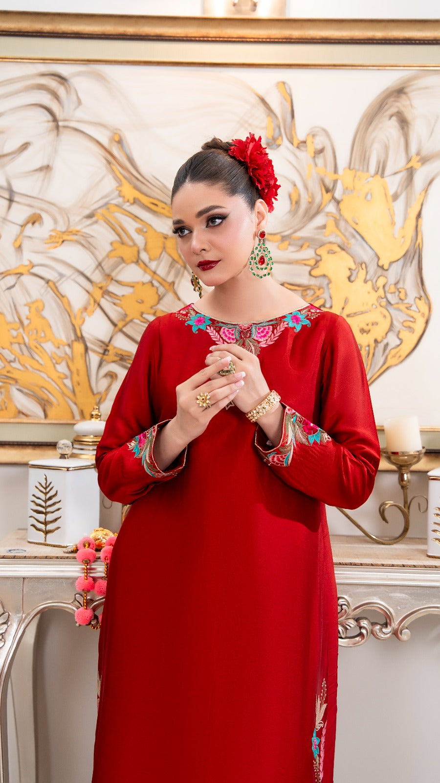 Shop Red Orchid by FAMA by Sana Sarah's, a stunning floor-length crimson silk tunic featuring turquoise and pink floral embroidery, side slit borders, and festive tassel details.