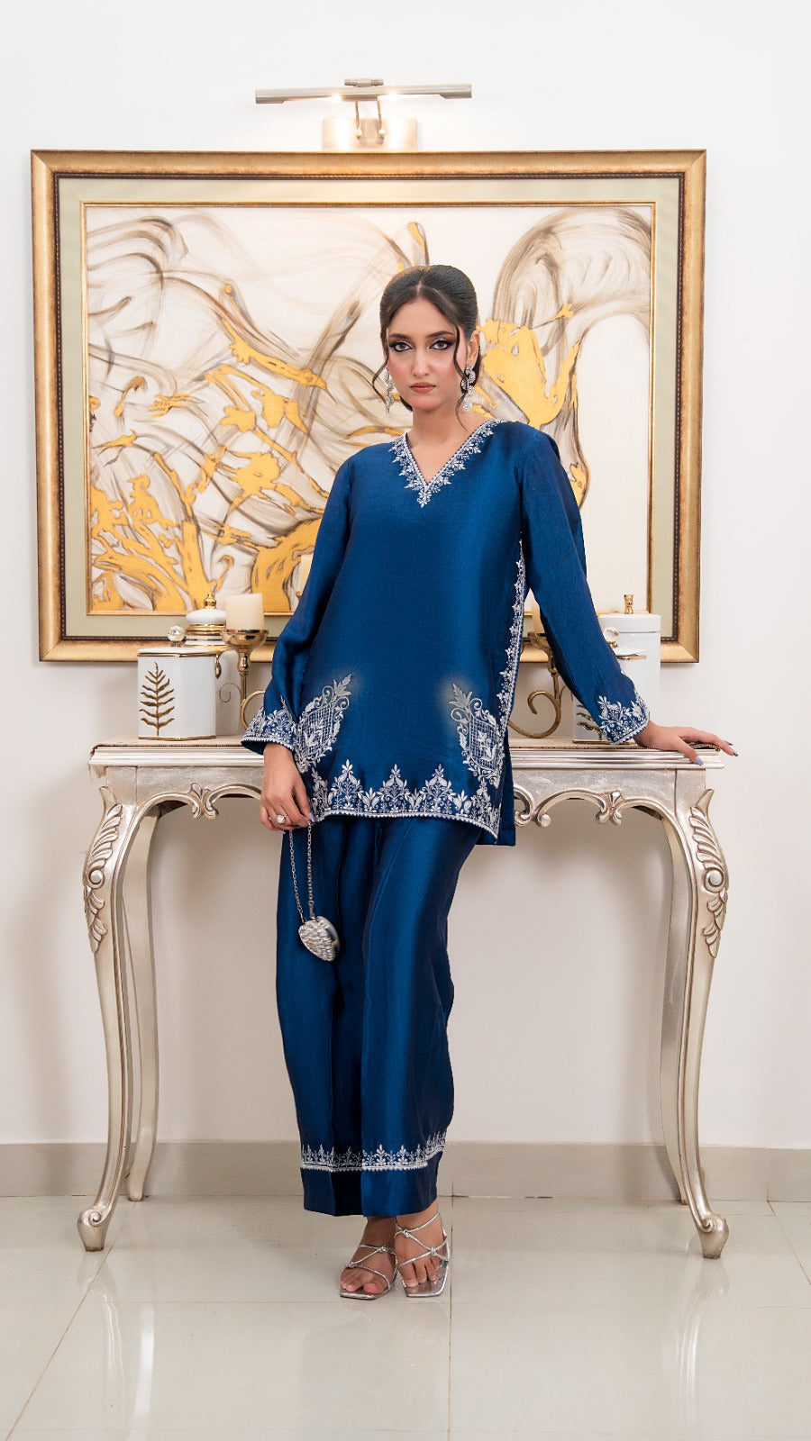 Shop Royal Blue by FAMA by Sana Sarah's, a stunning 2-piece royal blue silk tunic with fine silver hand embroidery, paired with matching wide-leg trousers.