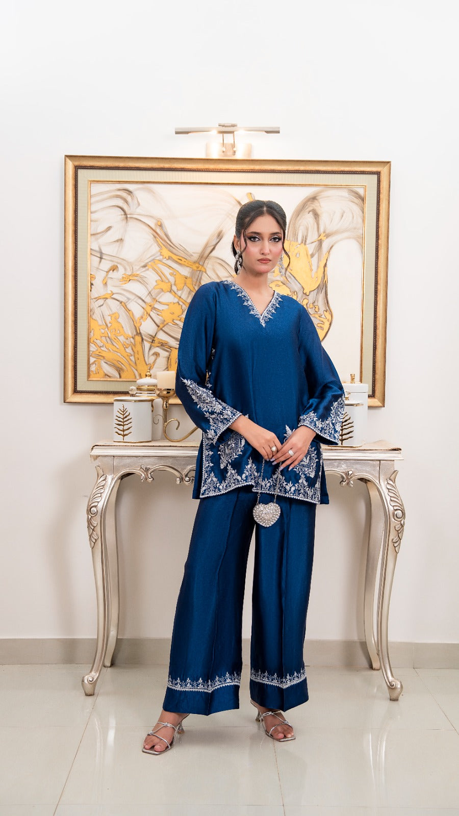 Shop Royal Blue by FAMA by Sana Sarah's, a stunning 2-piece royal blue silk tunic with fine silver hand embroidery, paired with matching wide-leg trousers.